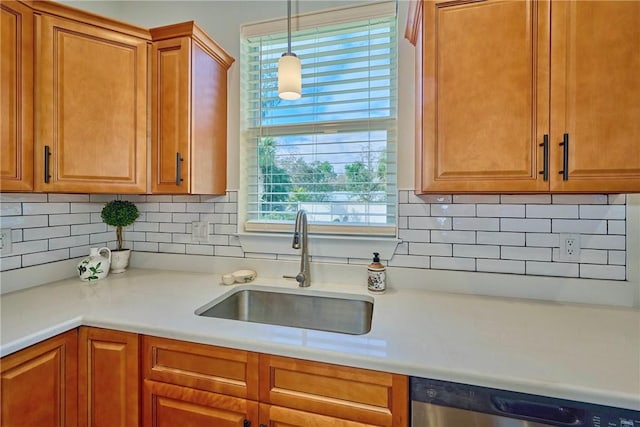 kitchen with sink, stainless steel dishwasher, decorative backsplash, and decorative light fixtures