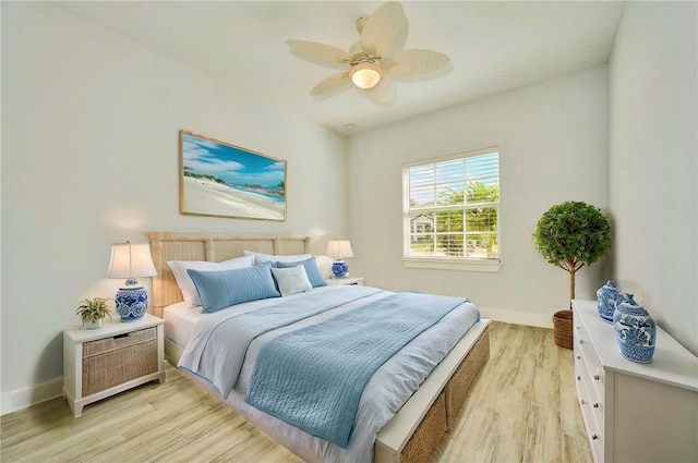 bedroom featuring ceiling fan and light hardwood / wood-style floors