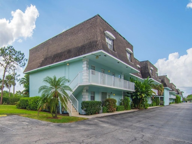1901 Indian River Blvd Unit 201A, Vero Beach, FL 32960 - view of building exterior featuring stairs