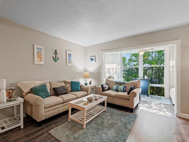 1901 Indian River Blvd Unit 201A, Vero Beach, FL 32960 - living area featuring hardwood / wood-style flooring, a textured ceiling, and baseboards