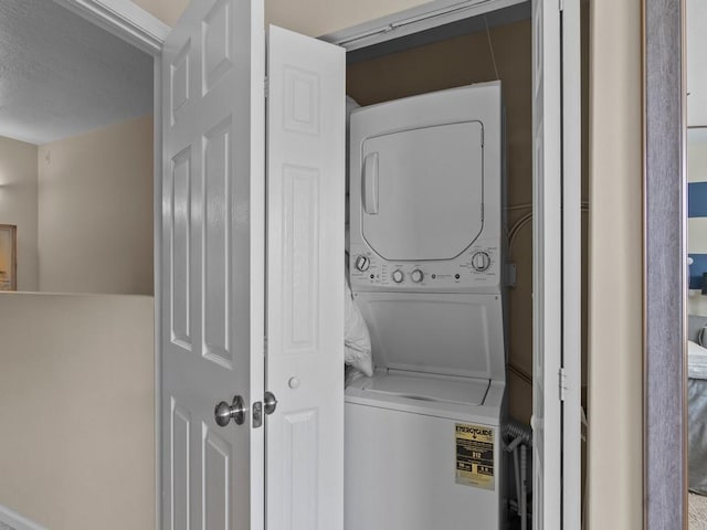 1901 Indian River Blvd Unit 201A, Vero Beach, FL 32960 - laundry area featuring stacked washing machine and dryer