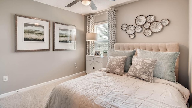 bedroom featuring ceiling fan and carpet