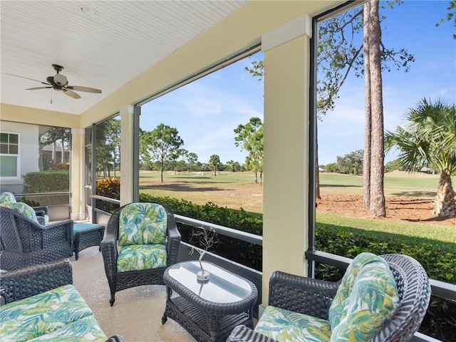 sunroom / solarium featuring ceiling fan and a wealth of natural light