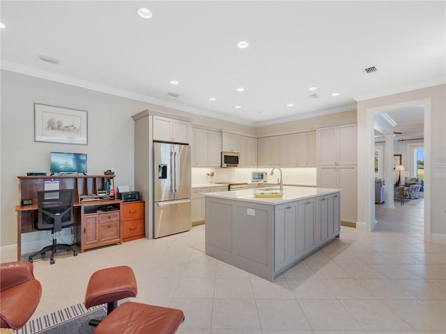 kitchen with gray cabinetry, a center island with sink, crown molding, light tile patterned floors, and stainless steel appliances