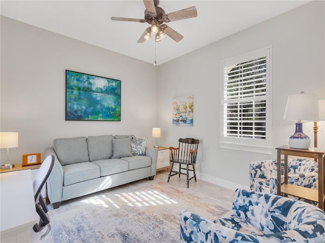 living room with hardwood / wood-style floors and ceiling fan