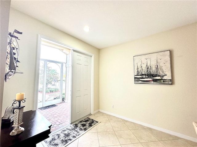 foyer entrance featuring light tile patterned flooring