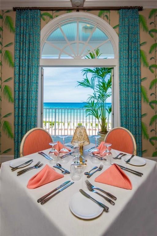 dining space featuring a water view