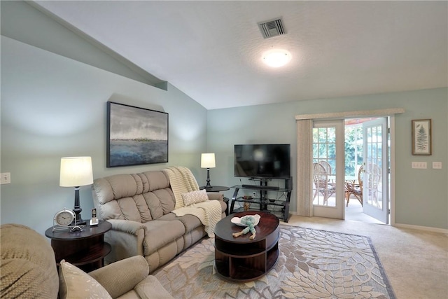 907 Starflower Ave, Sebastian, FL 32958 - carpeted living room featuring lofted ceiling and baseboards