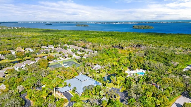 birds eye view of property with a water view and a residential view