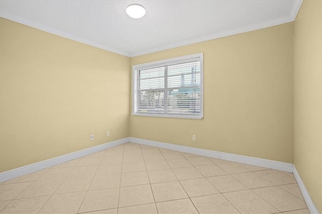 1845 Robalo Dr Unit 201D, Vero Beach, FL 32960 - empty room featuring baseboards, ornamental molding, and light tile patterned flooring