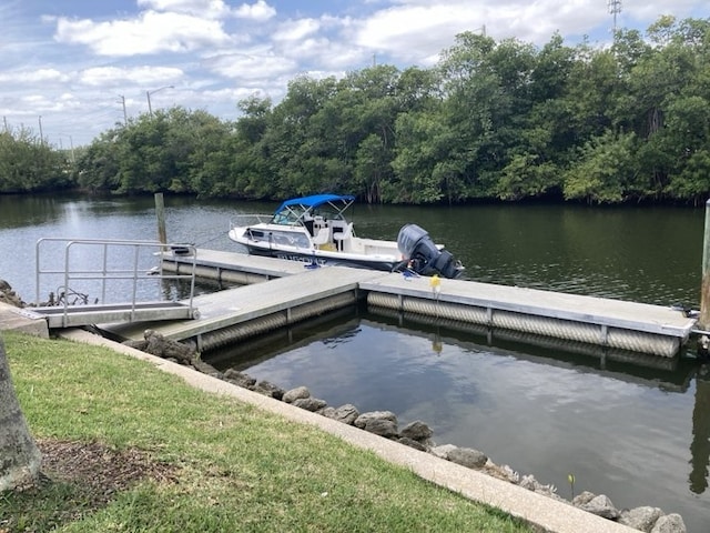 1845 Robalo Dr Unit 201D, Vero Beach, FL 32960 - dock area featuring a wooded view and a water view