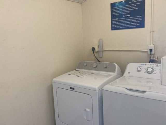 1845 Robalo Dr Unit 201D, Vero Beach, FL 32960 - washroom with washing machine and dryer