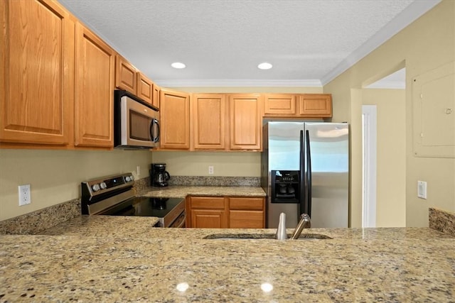 1845 Robalo Dr Unit 201D, Vero Beach, FL 32960 - kitchen featuring appliances with stainless steel finishes, light stone countertops, a sink, and recessed lighting