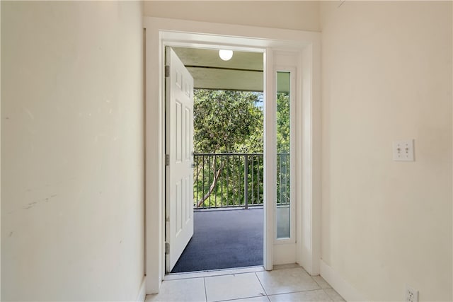 doorway to outside featuring light tile patterned floors