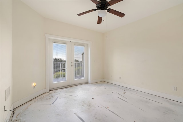 unfurnished room featuring french doors and ceiling fan