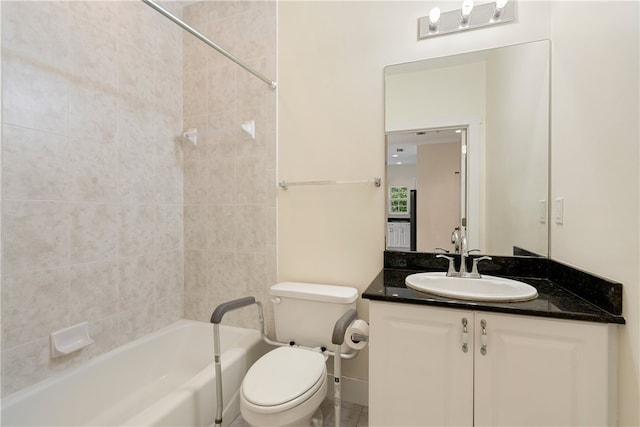 full bathroom with vanity, toilet, and tiled shower / bath