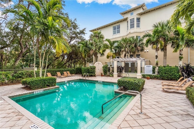 121 Palm Island Ln, Vero Beach, FL 32963 - community pool featuring a pergola, a patio, and fence