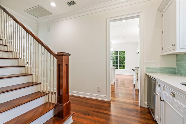 121 Palm Island Ln, Vero Beach, FL 32963 - staircase featuring wood finished floors, crown molding, recessed lighting, and baseboards