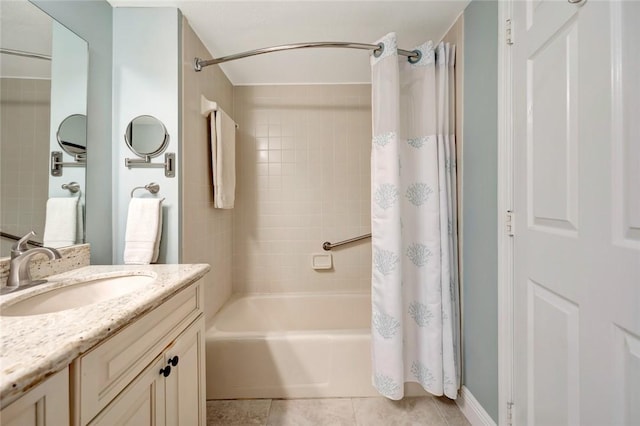 bathroom featuring tile patterned floors, vanity, and shower / bath combo