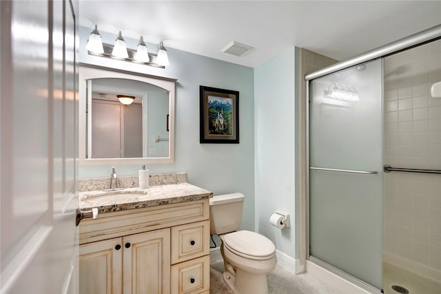 bathroom with an enclosed shower, vanity, and toilet