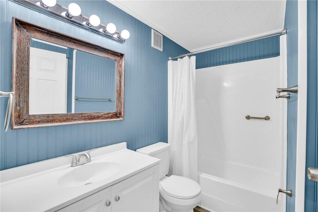 bathroom featuring vanity, visible vents, toilet, a textured ceiling, and shower / bath combo