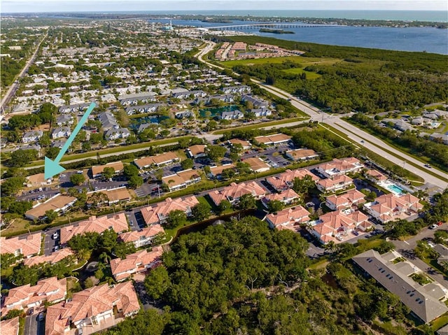 birds eye view of property featuring a water view and a residential view