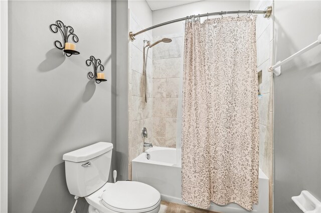 bathroom with toilet and shower / bath combination with curtain