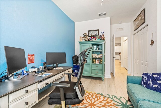 office space with light hardwood / wood-style flooring