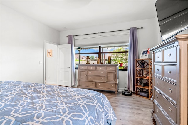 bedroom with light hardwood / wood-style floors