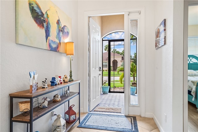 doorway featuring light tile patterned floors