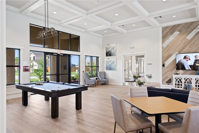 game room featuring french doors, light wood-type flooring, coffered ceiling, a high ceiling, and beamed ceiling