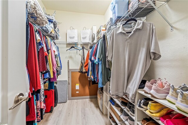 walk in closet featuring light hardwood / wood-style floors