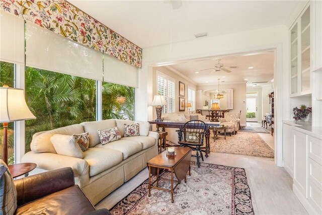 1135 Saint Georges Ln, Vero Beach, FL 32967 - living area with ceiling fan, recessed lighting, ornamental molding, and wood finished floors