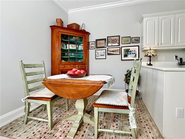 dining area with crown molding