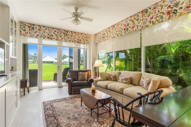 1135 Saint Georges Ln, Vero Beach, FL 32967 - living room with ceiling fan and light wood-type flooring