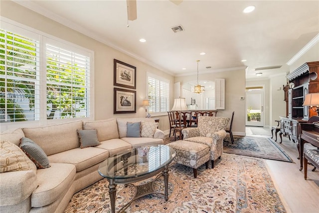 1135 Saint Georges Ln, Vero Beach, FL 32967 - living area with recessed lighting, light wood-style flooring, crown molding, and ceiling fan