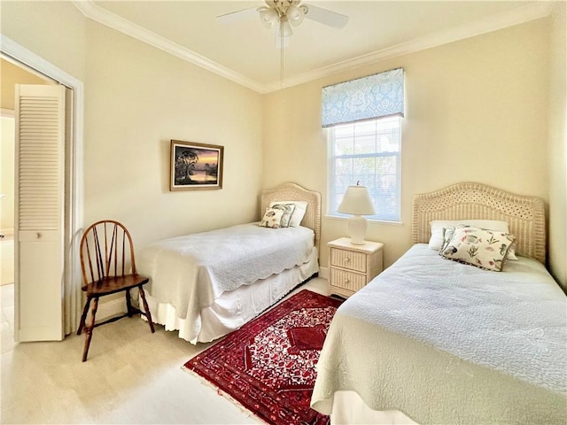 bedroom with ornamental molding, carpet, and ceiling fan