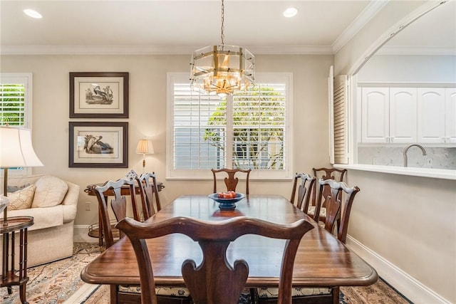 1135 Saint Georges Ln, Vero Beach, FL 32967 - dining area with a chandelier, plenty of natural light, recessed lighting, crown molding, and wood finished floors
