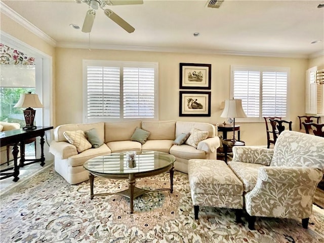 living room featuring ornamental molding and ceiling fan