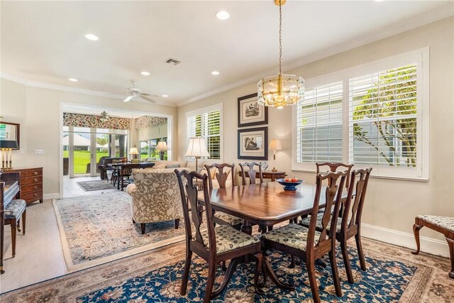 1135 Saint Georges Ln, Vero Beach, FL 32967 - dining space with a chandelier, healthy amount of natural light, ornamental molding, recessed lighting, and ceiling fan