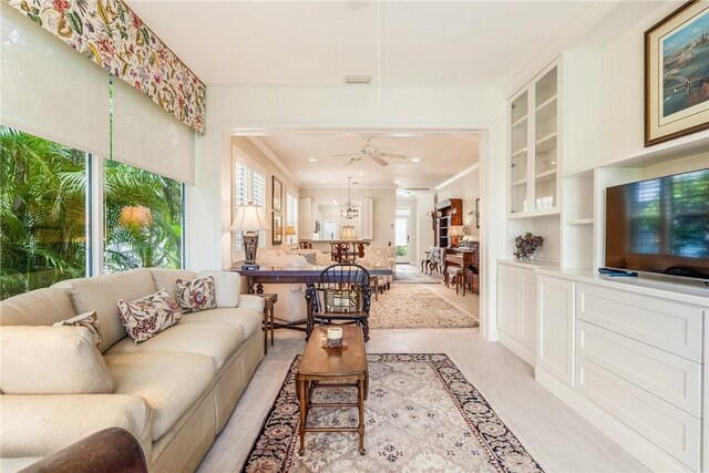 1135 Saint Georges Ln, Vero Beach, FL 32967 - living room with a ceiling fan and ornamental molding