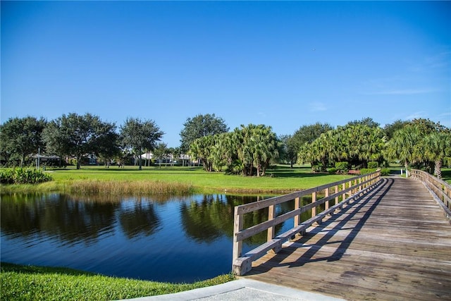 1135 Saint Georges Ln, Vero Beach, FL 32967 - dock featuring a water view and a lawn
