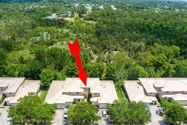 2597 Stockbridge Sq SW Unit 2597, Vero Beach, FL 32962 - aerial view of residential area with a forest