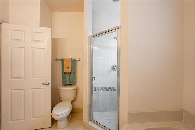 2597 Stockbridge Sq SW Unit 2597, Vero Beach, FL 32962 - bathroom with toilet, a shower stall, tile patterned flooring, and a bath