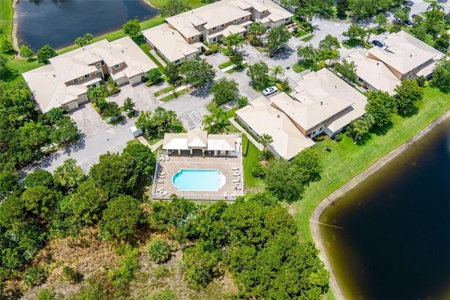 2597 Stockbridge Sq SW Unit 2597, Vero Beach, FL 32962 - aerial view of property's location with a pool, a nearby body of water, and nearby suburban area