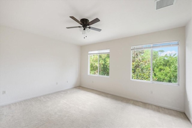 2597 Stockbridge Sq SW Unit 2597, Vero Beach, FL 32962 - spare room with plenty of natural light, light colored carpet, and baseboards