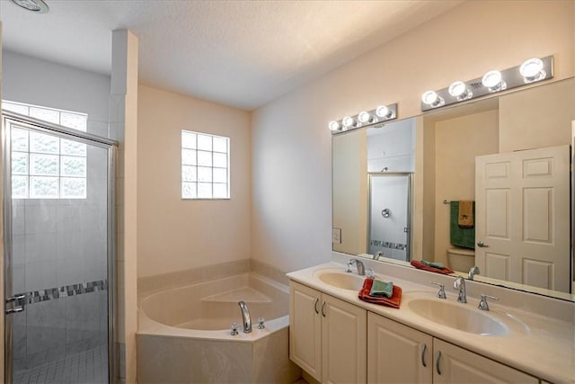 2597 Stockbridge Sq SW Unit 2597, Vero Beach, FL 32962 - bathroom featuring a bath, a shower stall, and double vanity