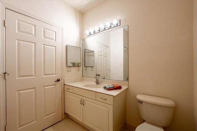 2597 Stockbridge Sq SW Unit 2597, Vero Beach, FL 32962 - bathroom with vanity, toilet, and tile patterned floors