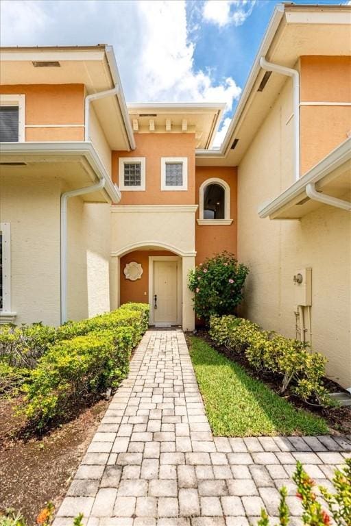 2597 Stockbridge Sq SW Unit 2597, Vero Beach, FL 32962 - property entrance with stucco siding