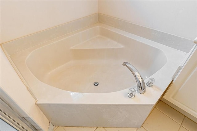 2597 Stockbridge Sq SW Unit 2597, Vero Beach, FL 32962 - bathroom with a garden tub and tile patterned floors